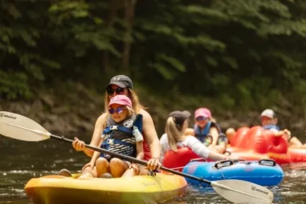 a group of people riding on the back of a boat