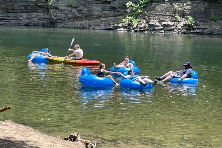 a group of people on a raft in a body of water