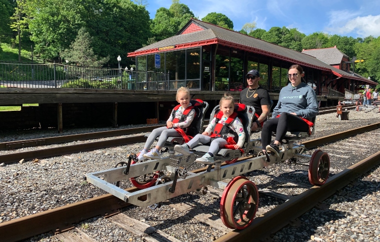 a group of people sitting around a track