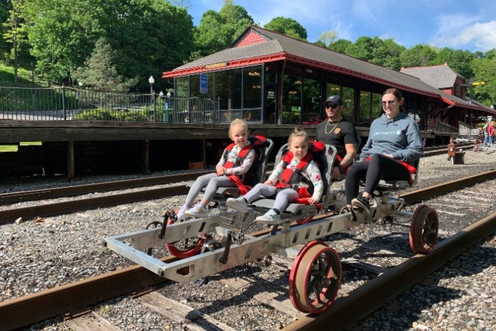 a group of people sitting around a track