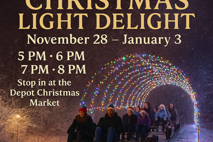 People on a rail cart under a tunnel of Christmas lights in snowy night scene.
