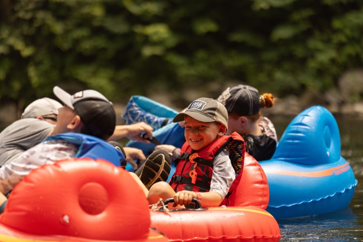 a group of people on a raft